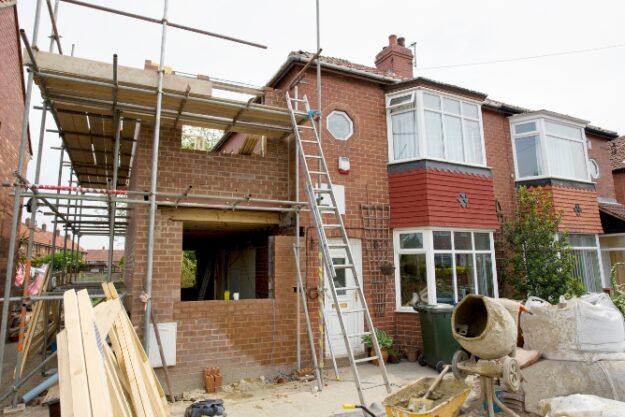 House extension under construction in Birmingham with structural steel installation House extension under construction in Birmingham with structural steel installation